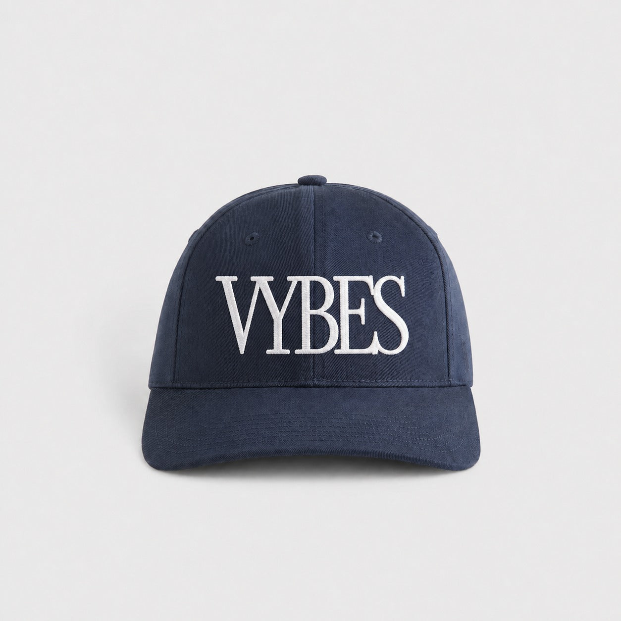 VYBES Heritage Embroidered Cap in navy, front view with white VYBES embroidery